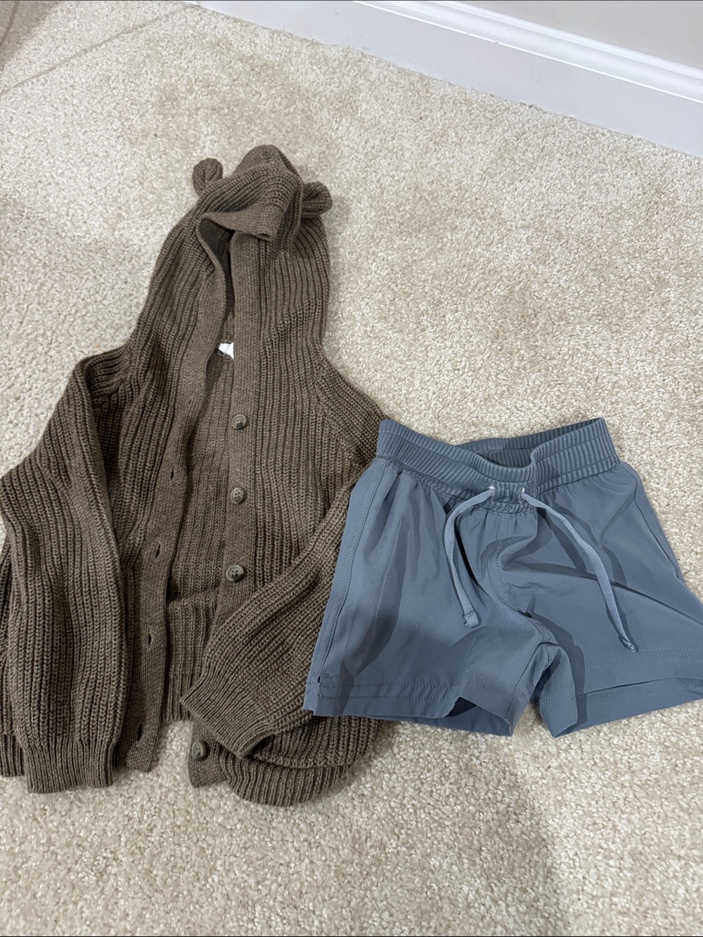 Jamie Kay sweater and swim trunks
